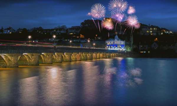 Fireworks above the Royal Hotel with Bideford old bridge in the foreground