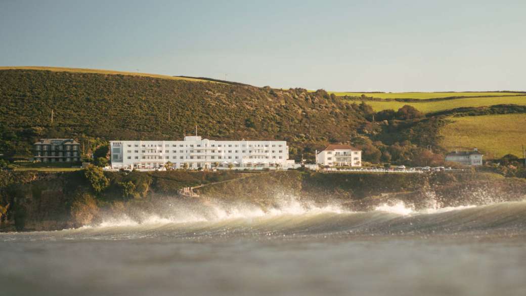 Saunton Sands Hotel Exterior View from Sea with Crashing Wave