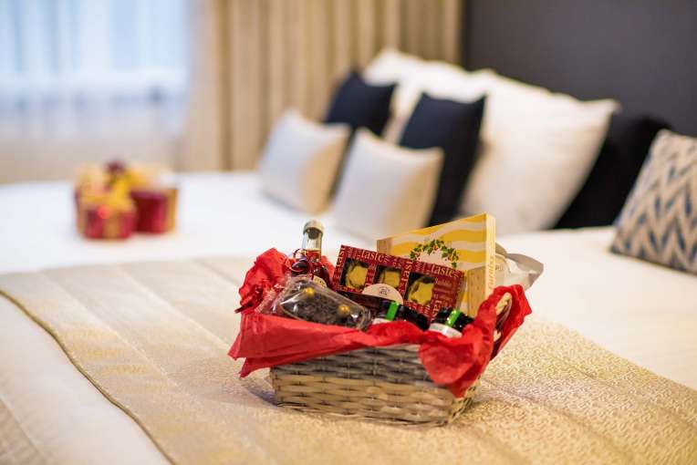 Barnstaple Hotel Christmas Hamper on Bed in Room