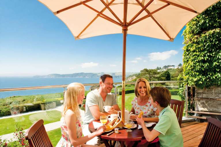 Carlyon Bay Hotel Family Eating Breakfast and Enjoying View from Balcony