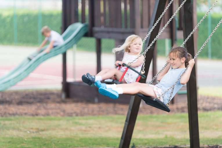 Carlyon Bay Hotel Children on Swings in Play Area