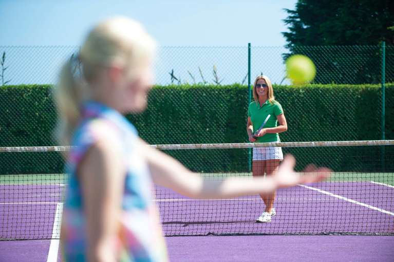 Carlyon Bay Hotel Mother and Daughter Enjoying a Game on the Outdoor Tennis Courts