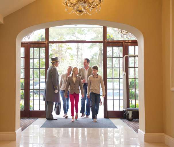 Carlyon Bay Hotel Family Greeted at Hotel Entrance by Doorman