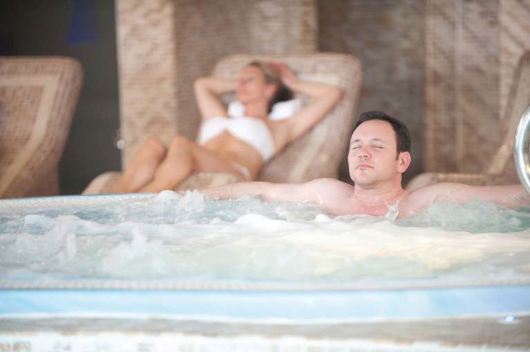 Carlyon Bay Hotel Guest Relaxing in Jacuzzi Spa Hot Tub
