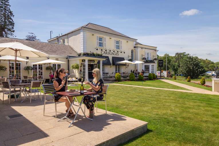 Devon Hotel Carriages Restaurant Guests Enjoying Afternoon Tea with Prosecco Outdoors on Lawn Terrace