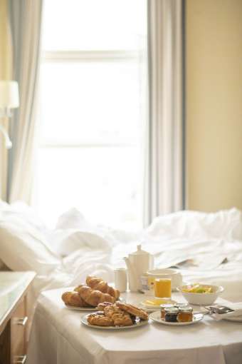 Royal Duchy Hotel Breakfast Tray with Pastries by Bed in Room