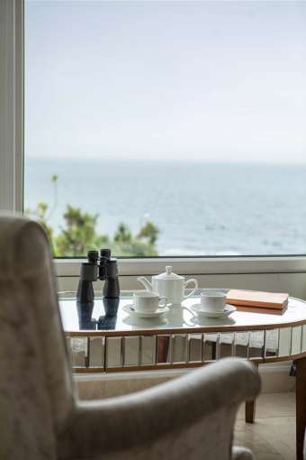 Royal Duchy Hotel Armada Room with Sea View and Tea Pot on Table with Binoculars