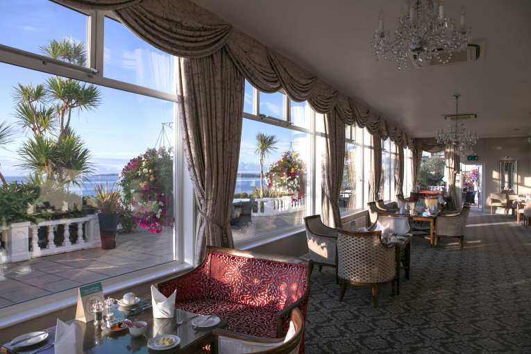 Royal Duchy Hotel Lounge Seating Area Set for Breakfast with Sea View