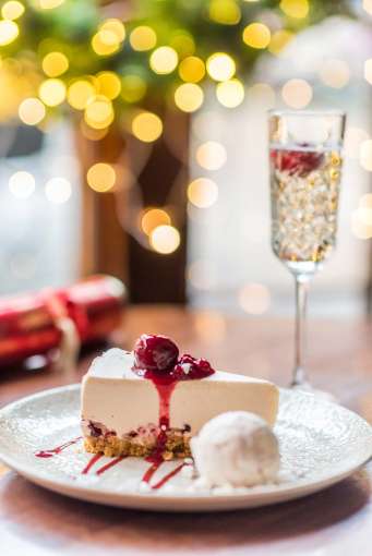 Royal and Fortescue Hotel 62 the Bank Restaurant Dining Festive Raspberry Ripple Cheesecake with Prosecco and Christmas Cracker