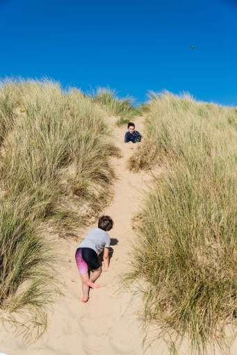 Saunton Sands Hotel Children Climbing Sand Dune on Saunton Beach