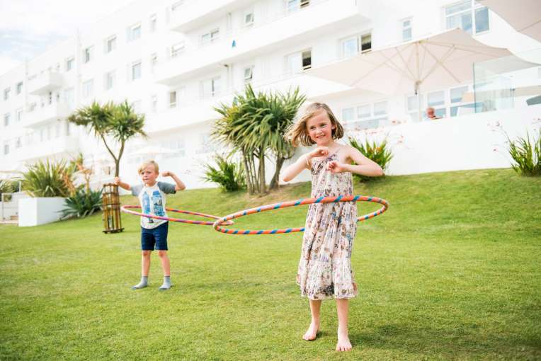Saunton Sands Hotel Children with Hula Hoops Playing on Lawn in Front of Hotel