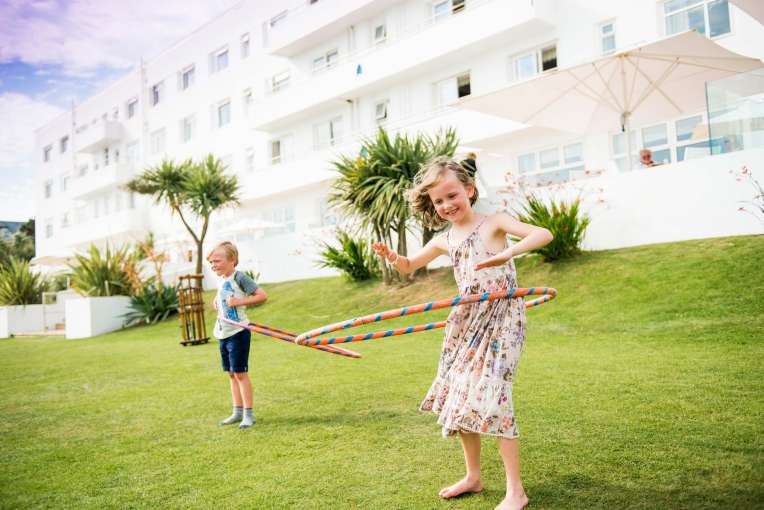 Saunton Sands Hotel Children with Hula Hoops Playing on Lawn in Front of Hotel