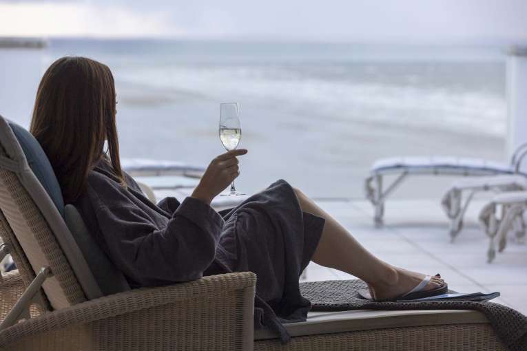 Saunton Sands Hotel Source Spa Guest Taking in View from Relaxation Room with Prosecco
