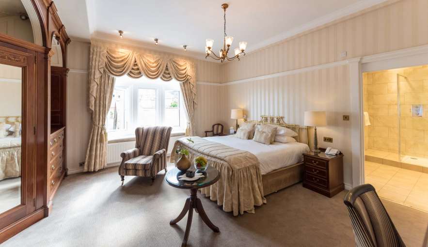 Victoria Hotel Deluxe Garden View Room (109) Accommodation Bedroom with Seating Area