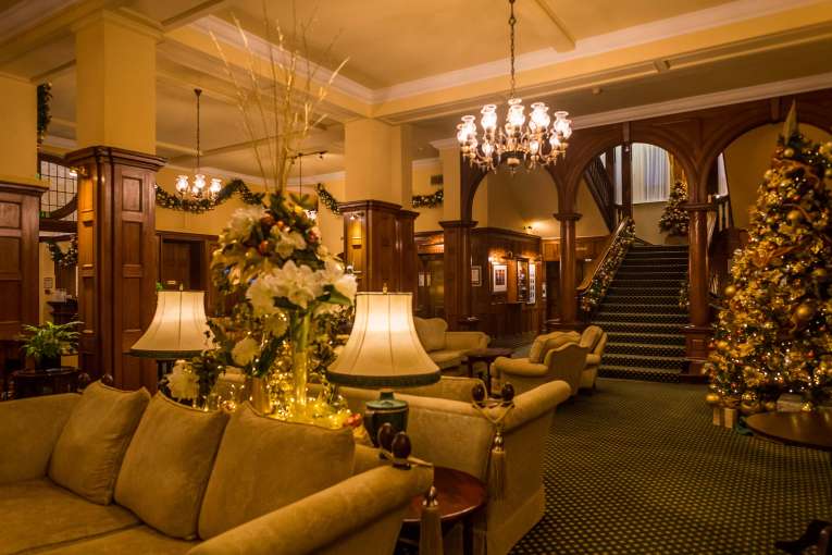 Victoria Hotel Foyer and Lounge with Staircase Decorated for Christmas