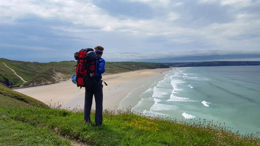 A hiker overlooking a beach