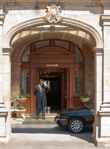 Doorman welcoming car at the Victoria hotel 