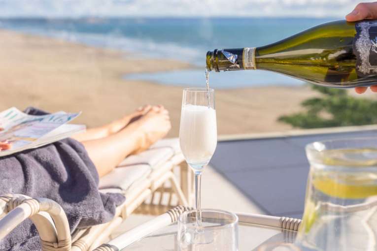 Pouring Prosecco on Saunton's rooftop terrace