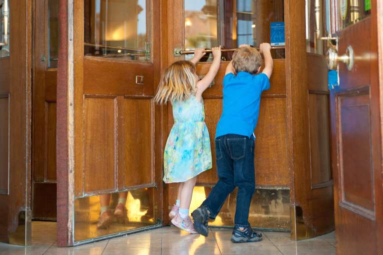 Kids Pushing Sliding Door at Victoria Hotel