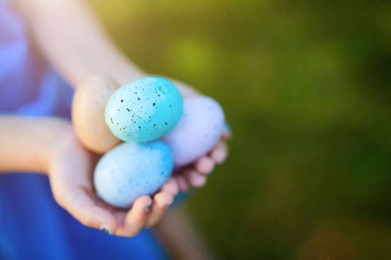 girl holding easter eggs