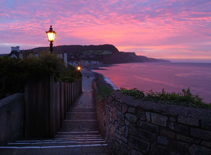 View of sidmouth beach at sunrise