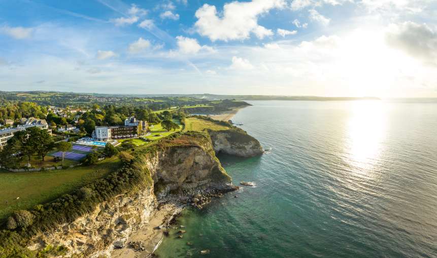 Aerial photo of the carlyon bay hotel showing beach below 