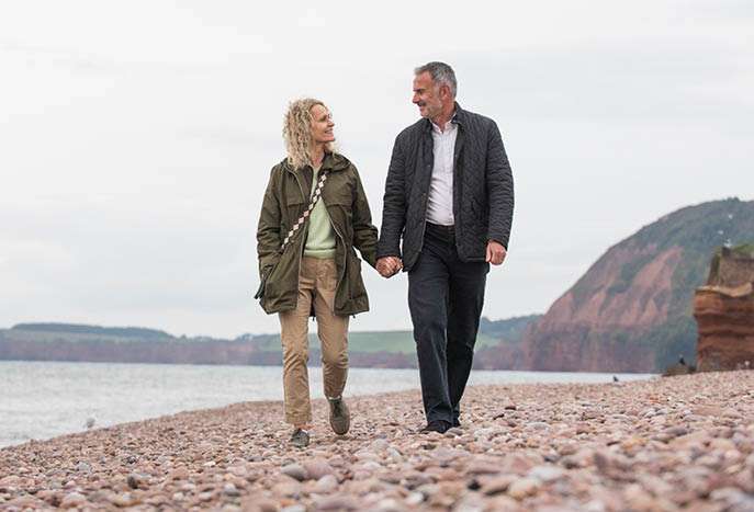 Couple walking on the beach