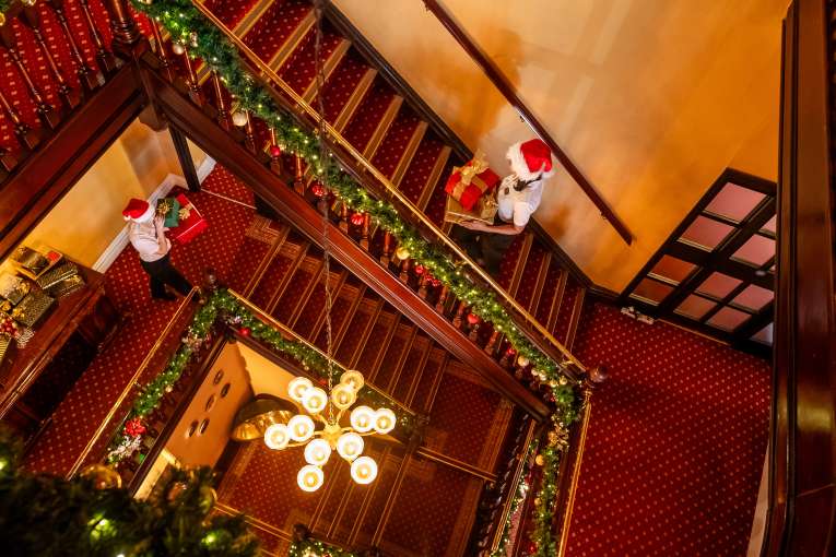 Aerial View of Imperial Staff Carrying Presents at Staircase