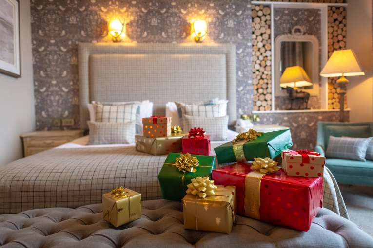 Christmas presents on bed at Royal Hotel