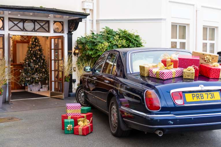 Rolls Royce at Hotel Entrance with Christmas Gifts 