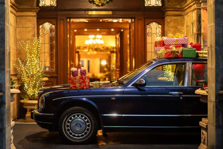 Rolls Royce at hotel Entrance with Christmas Gifts