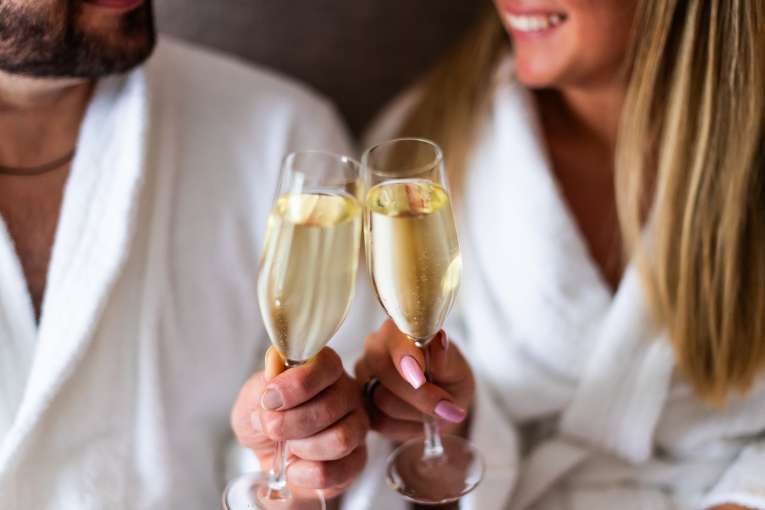 Couple saying cheers with prosecco