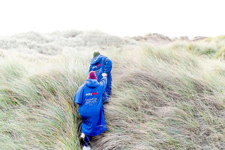 Couple walking in Saunton sand-dunes 