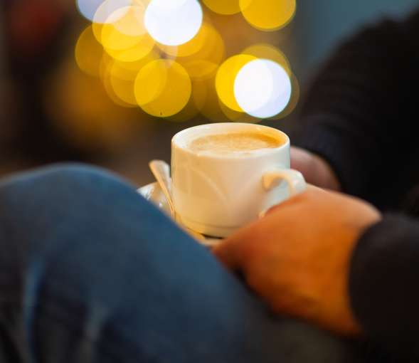 Hand holding coffee