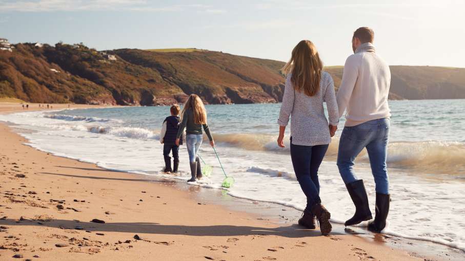 Family walking on beach