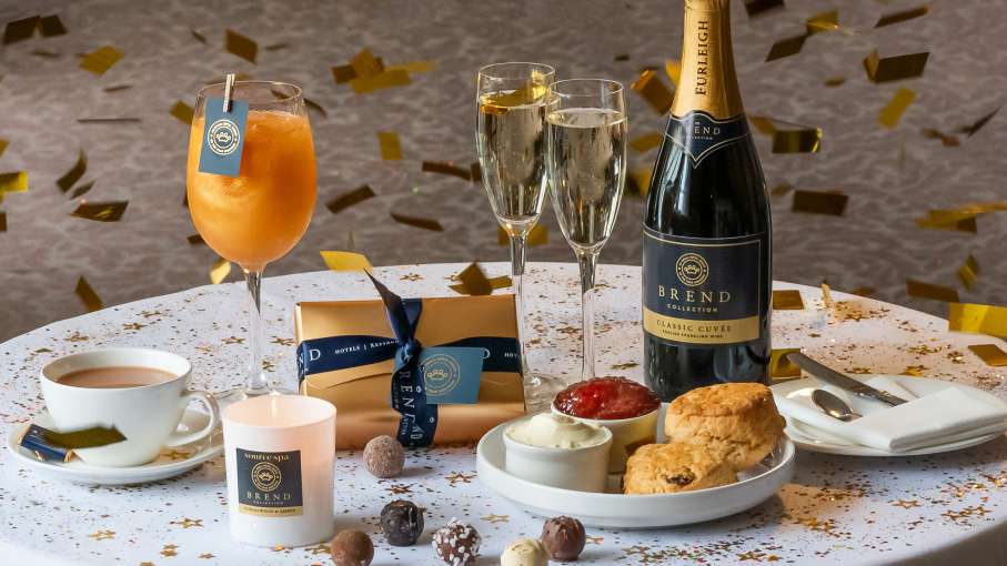 Cream Tea, Wine & Chocolates on table with confetti