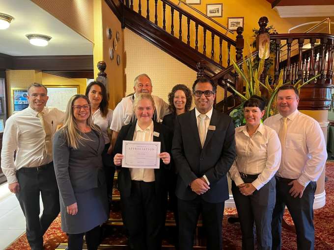 Justyna and team holding certificate 