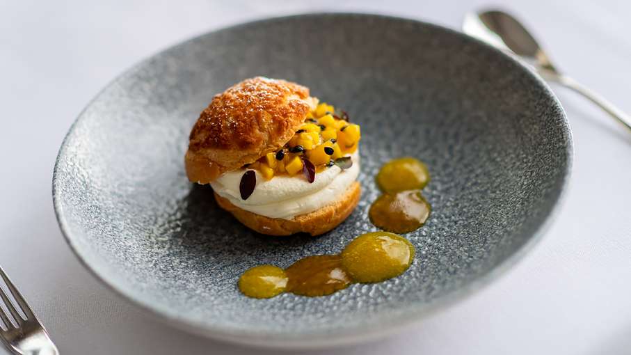 Craquelin Profiterole with Lime Chantilly and Mango Passion Fruit