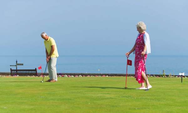Belmont Hotel Couple Enjoying Putting Green on the Hotel Lawn