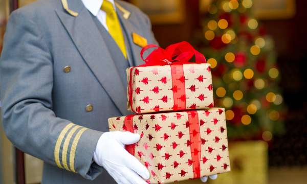 Carlyon Bay Hotel Doorman Carrying Christmas Presents