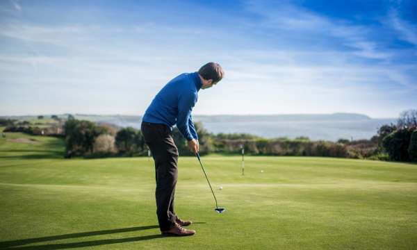 Carlyon Bay Hotel Golfer on Golf Course Overlooking Sea