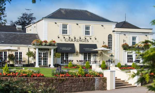 Devon Hotel Carriages Restaurant Exterior with Flowers