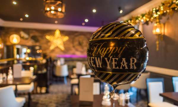 Devon Hotel Carriages Restaurant Decorated for Christmas with New Years Balloon