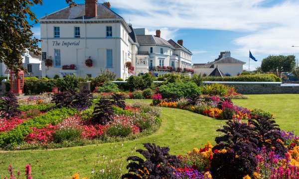 Imperial Hotel Exterior View with Flower Beds