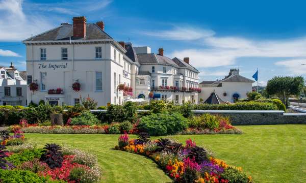 Imperial Hotel Exterior View with Flower Beds