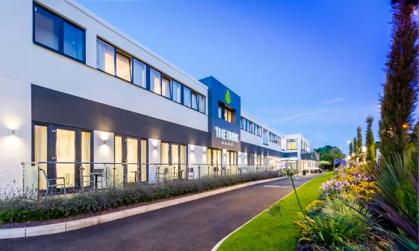 Park Hotel External View with Flowers Evening Time