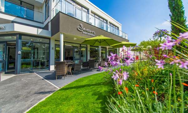 Park Hotel Seasons Bar and Brasserie External View with Outdoor Seating and Flowers