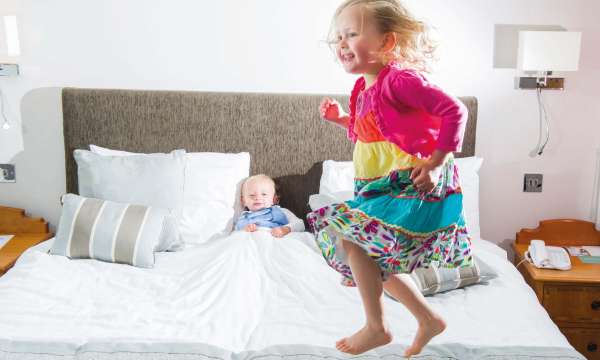 Saunton Sands Hotel Accommodation Child Jumping on Bed