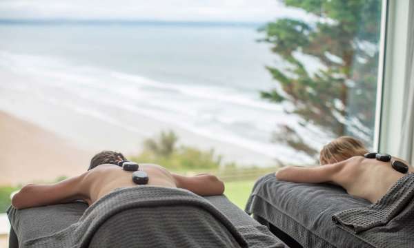 Saunton Sands Hotel Source Spa Guests Receiving Hot Stone Massages in Treatment Room