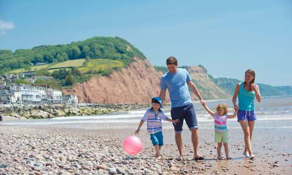 Victoria Hotel Family Walking Along Beach at Sidmouth